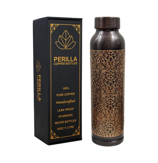 Copper water bottle with intricate design next to its packaging box, featuring 'Perilla' branding.